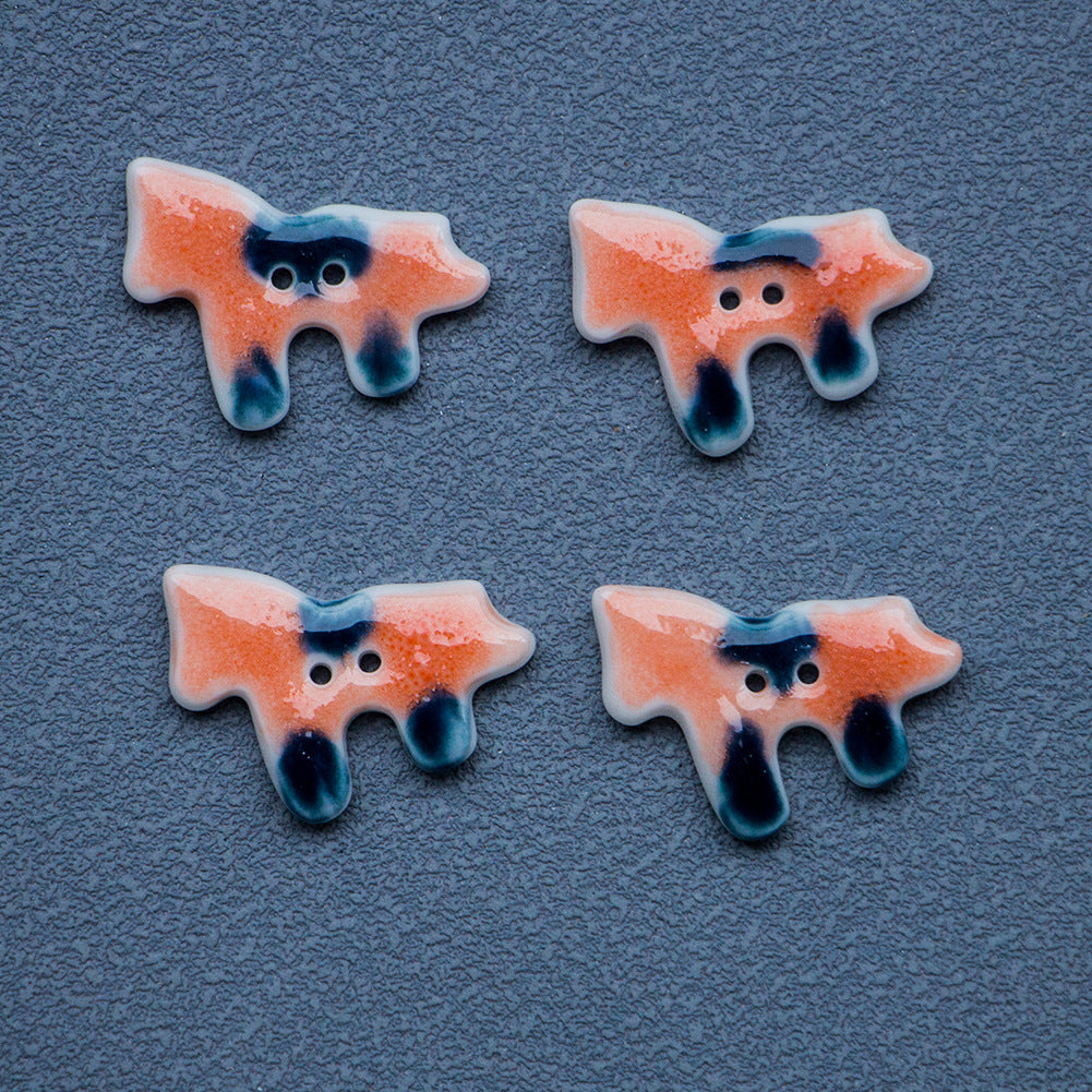 Vier orange Pony-Knöpfe mit 2 Löchern, blau getönte Tropfen-Optik
