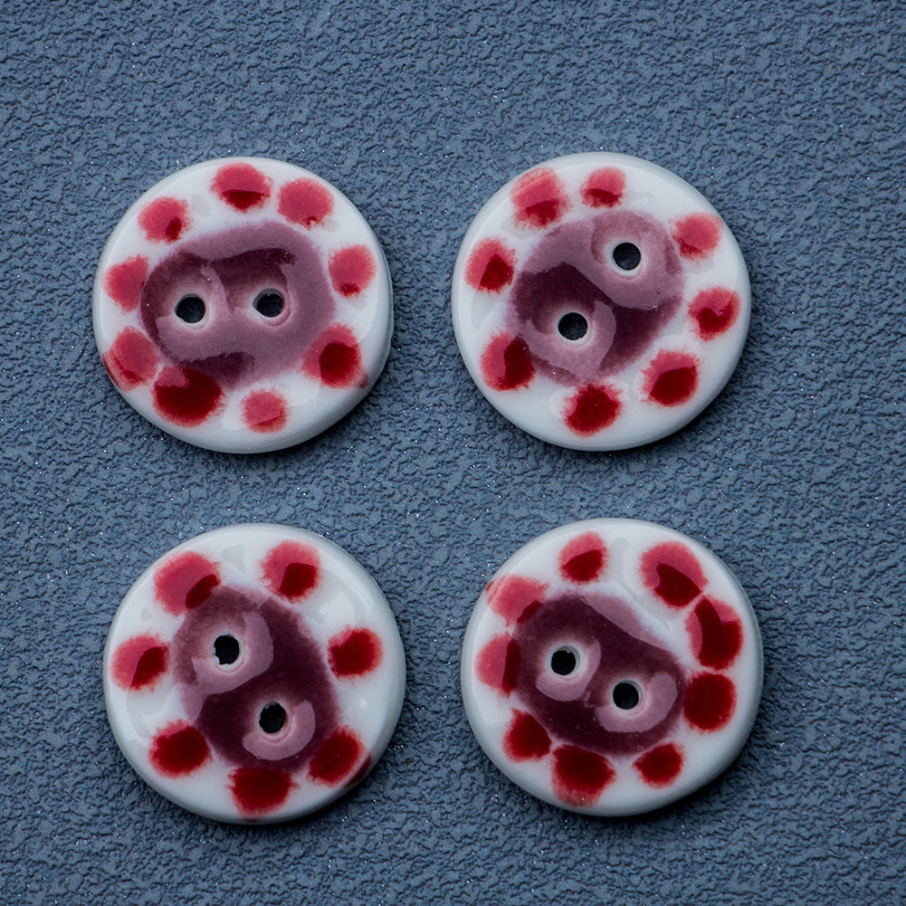 Four handmade ceramic buttons, white base with red dots and pig faces, 2-hole each
