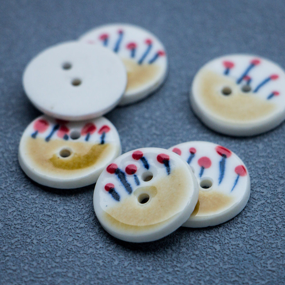 Set of four round ceramic buttons, tea yellow with red flower stems, 2 holes