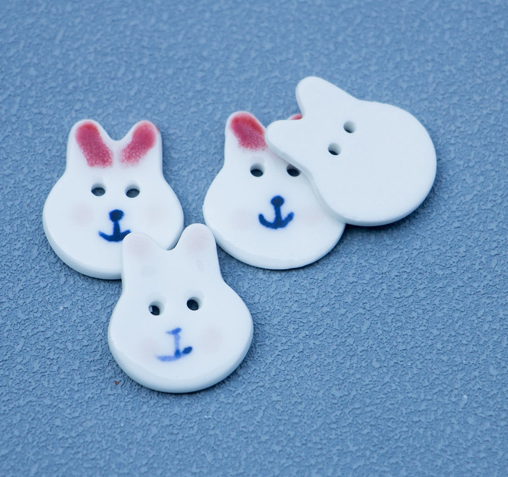 Rabbit ceramic buttons, 2-hole, red/pink ear paint, anchor face, three pieces