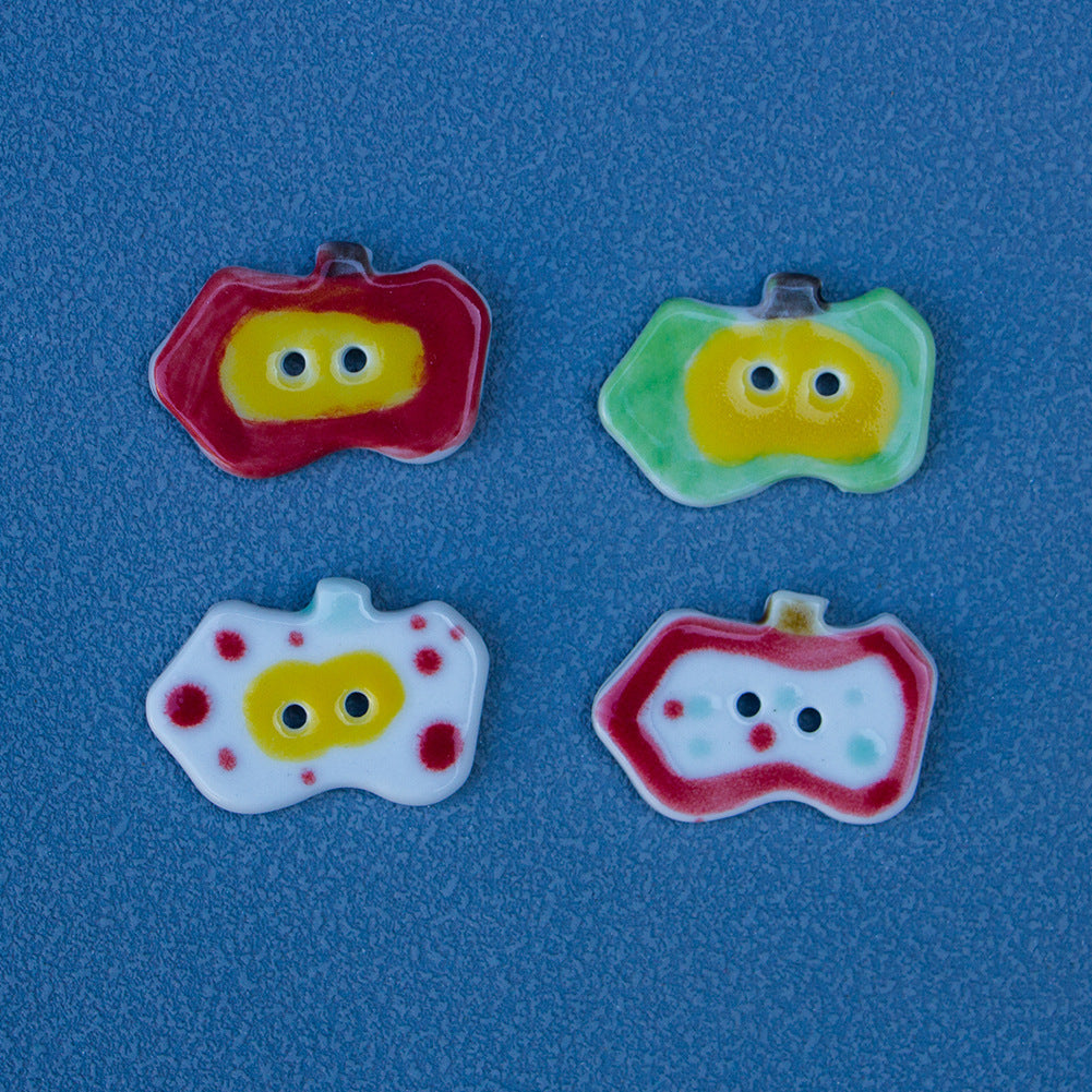 Set of ceramic apple buttons: red rim, green rim, and white face with details (Style B)