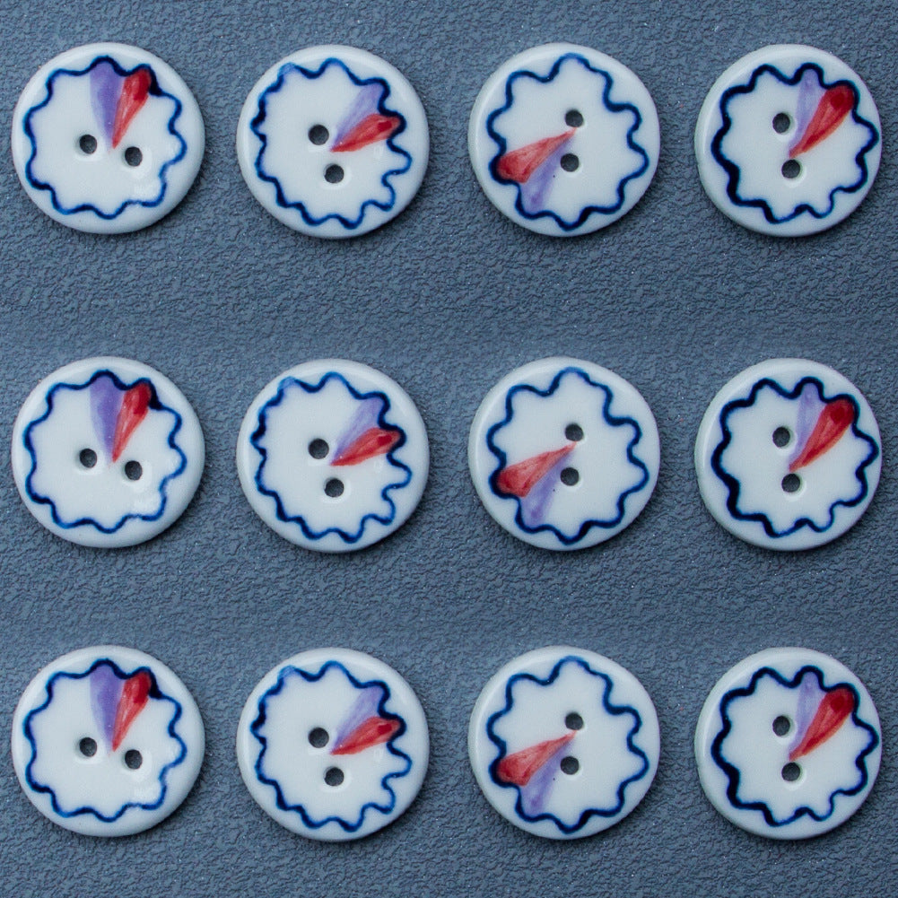 Four ceramic 2-hole buttons, blue ring edge with red and purple center accents
