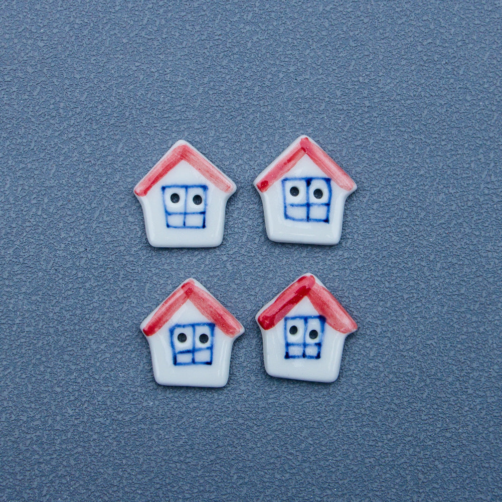 White ceramic house button with red roof and blue face, 4-pack