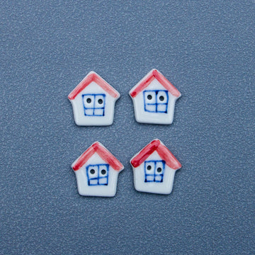 White ceramic house button with red roof and blue face, 4-pack