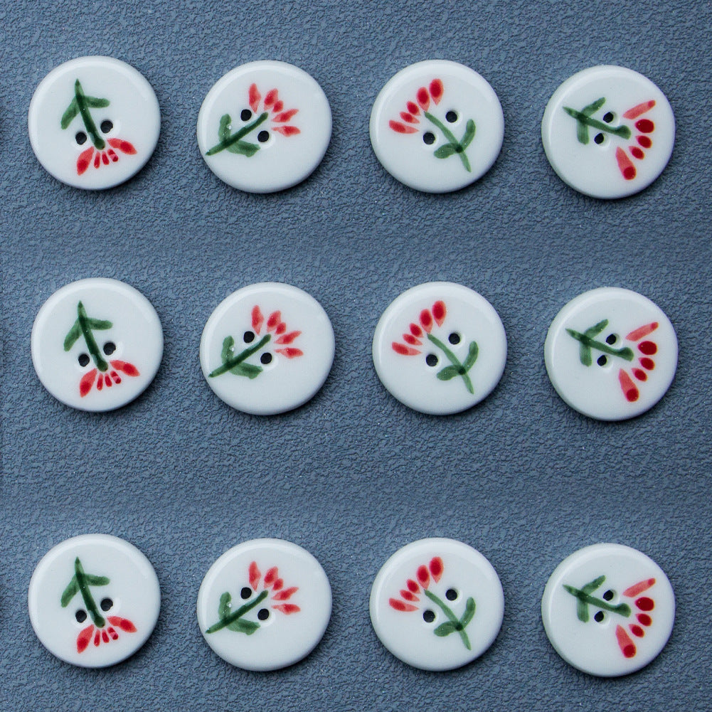 White round 2-hole ceramic buttons with red flower and green leaf accents (4 pcs)