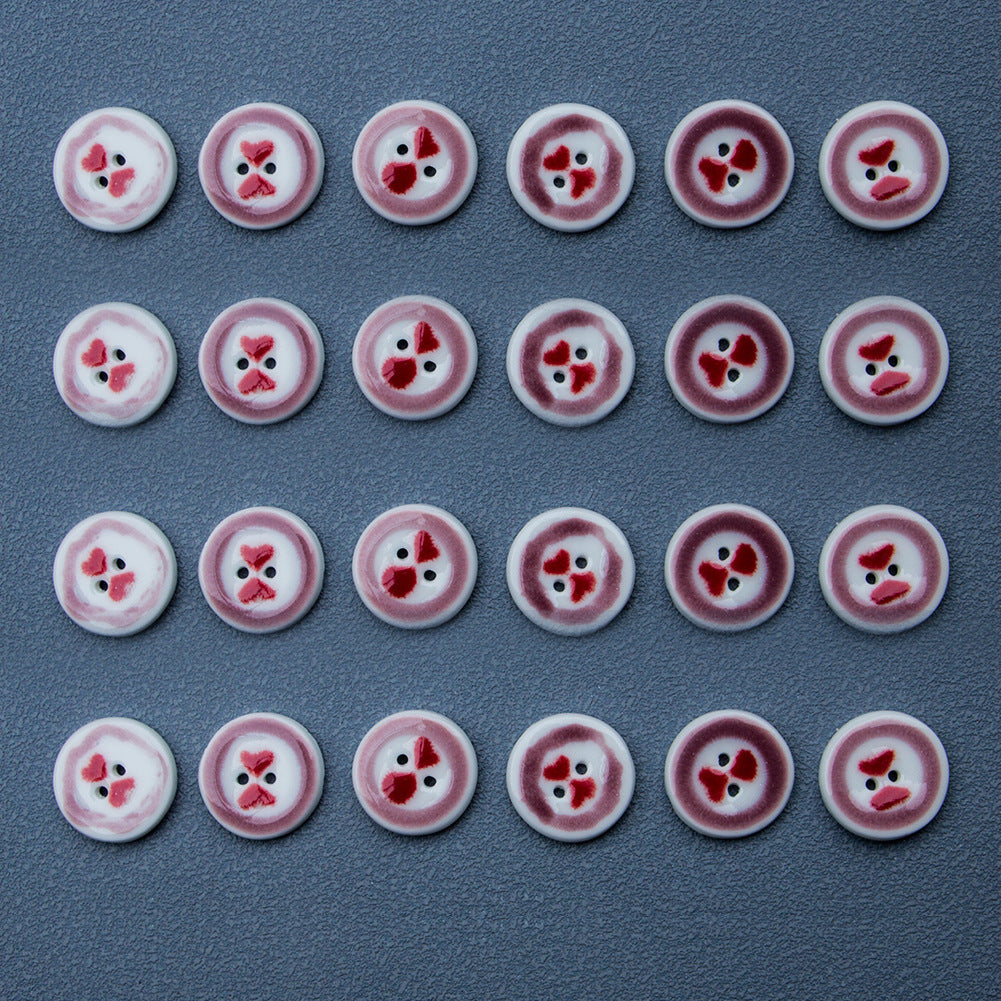 Set of round ceramic buttons with red heart pattern and 2-hole design