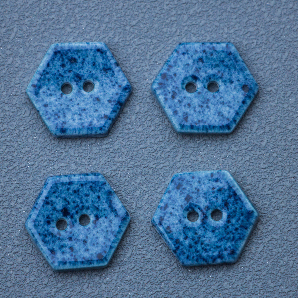Navy blue hexagonal ceramic buttons, two holes each, speckled surface detail