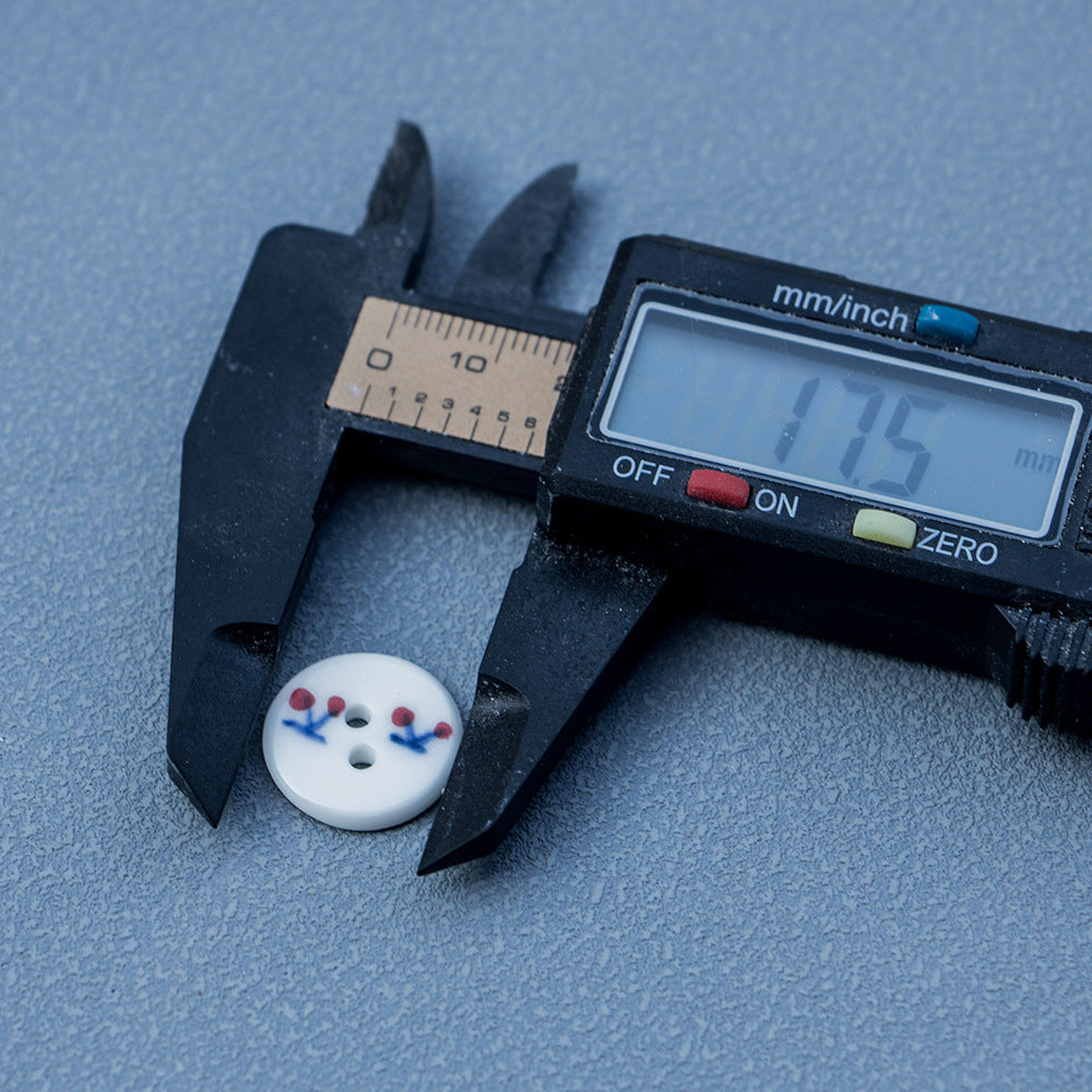 18mm ceramic buttons, 2-hole, white with red cherry motif; size shown by caliper