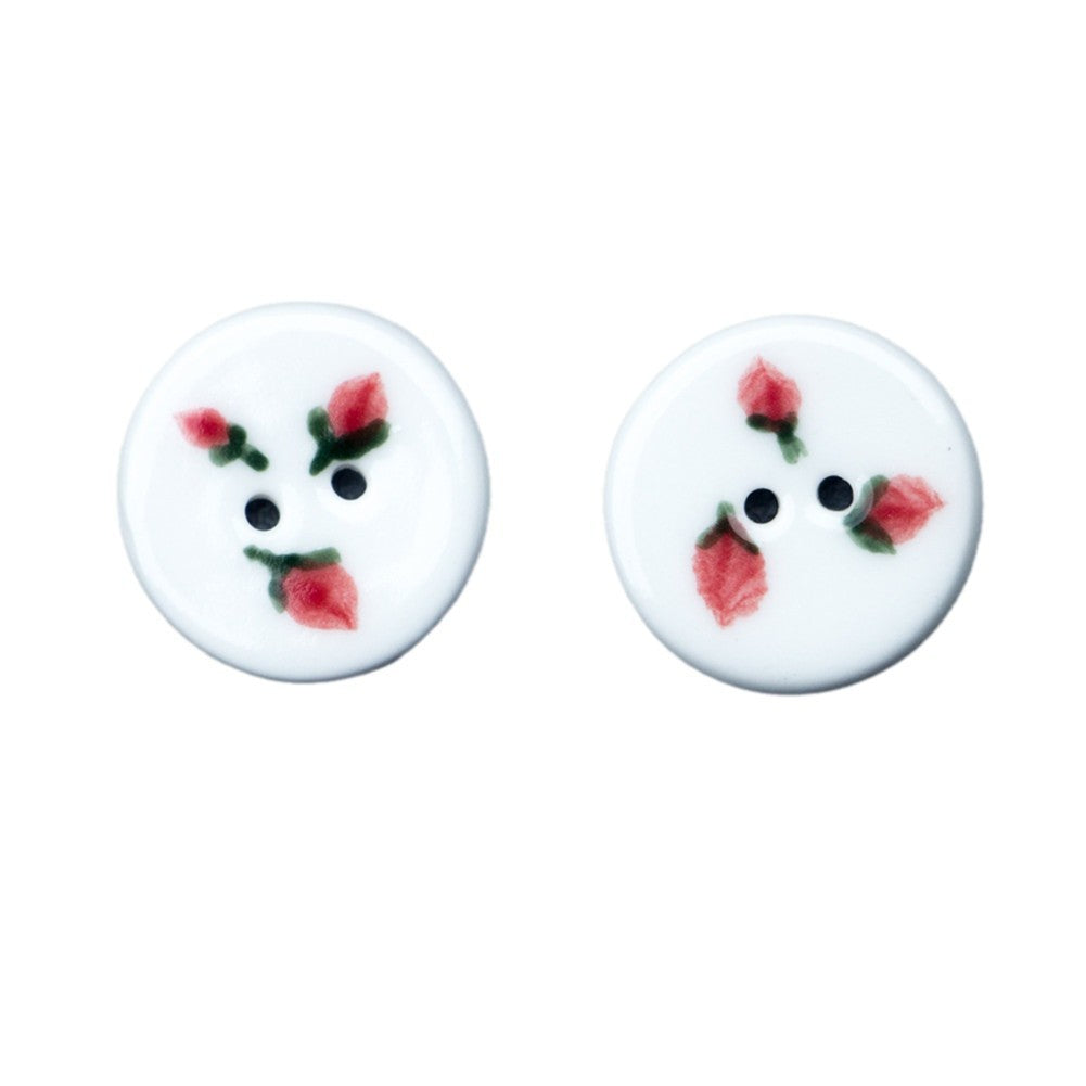 Round ceramic button: three hand-painted strawberries, two holes.
