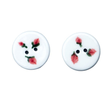 Round ceramic button: three hand-painted strawberries, two holes.