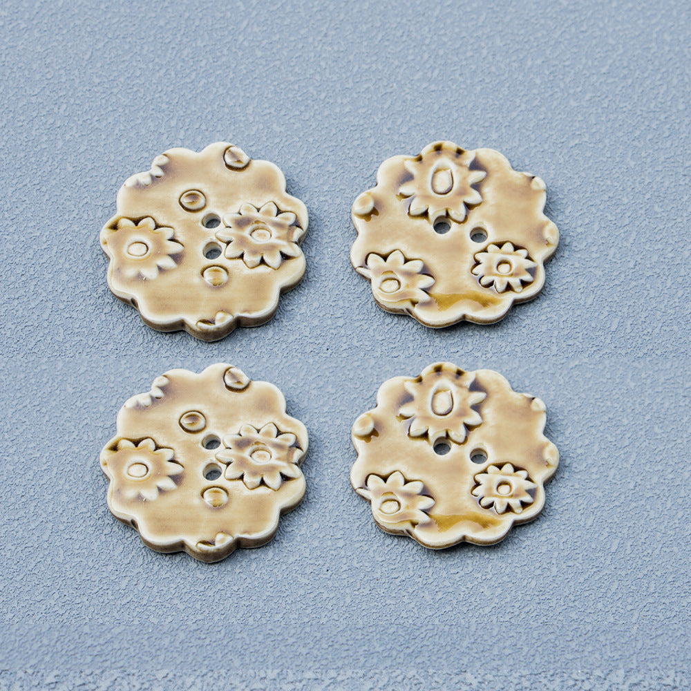 Tawny ceramic round buttons with floral relief; multiple two-hole button views
