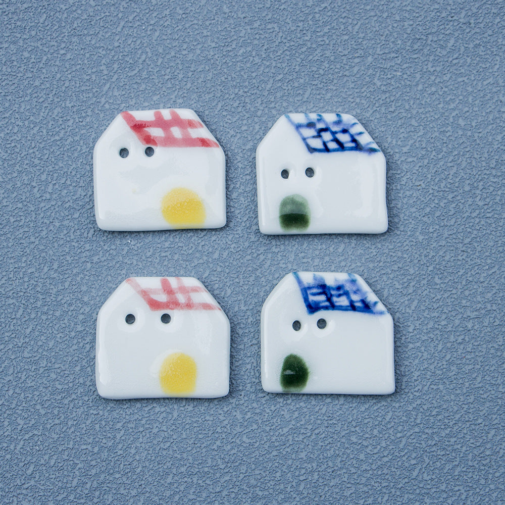 Handmade ceramic house buttons, red & blue tiled roofs, two-hole faces (4 shown)