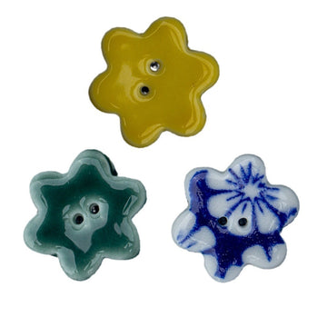 Ceramic flower buttons, yellow and green with blue floral design, 2-hole backs