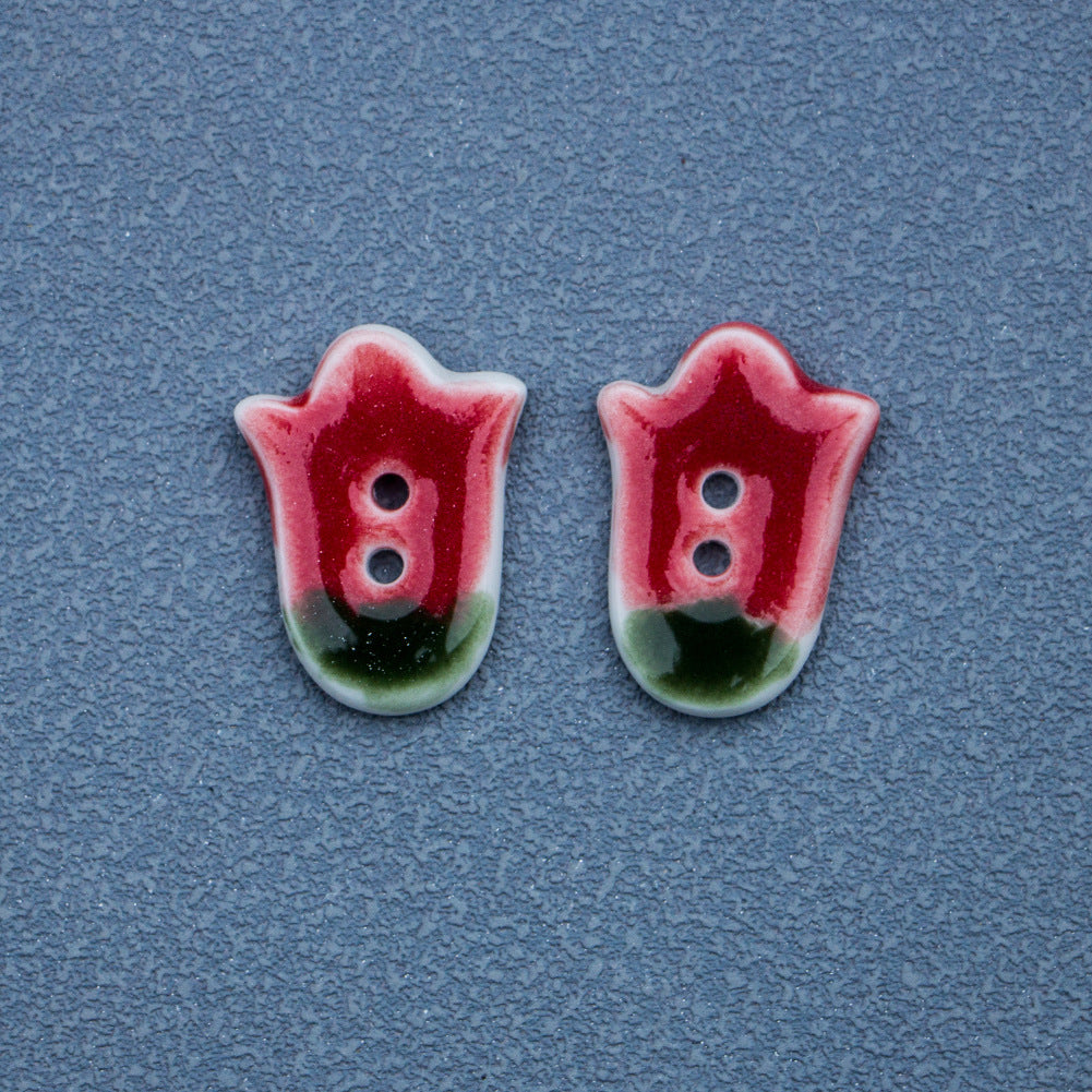 Two red tulip ceramic buttons with two holes each, red top and green base