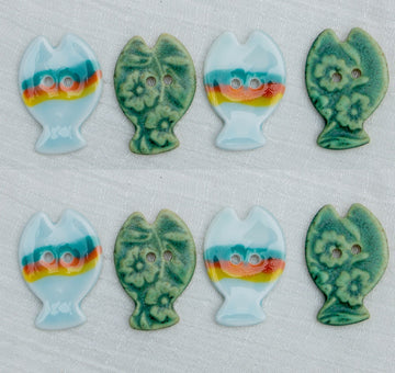 Hand-painted ceramic fish buttons with two holes, rainbow and bronze green mix