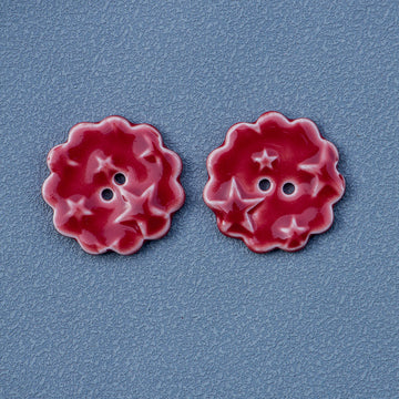 Red round ceramic buttons with star pattern, two-hole design