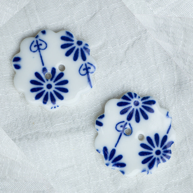 30mm ceramic two-hole flower buttons with blue floral linework on white (2 pcs)