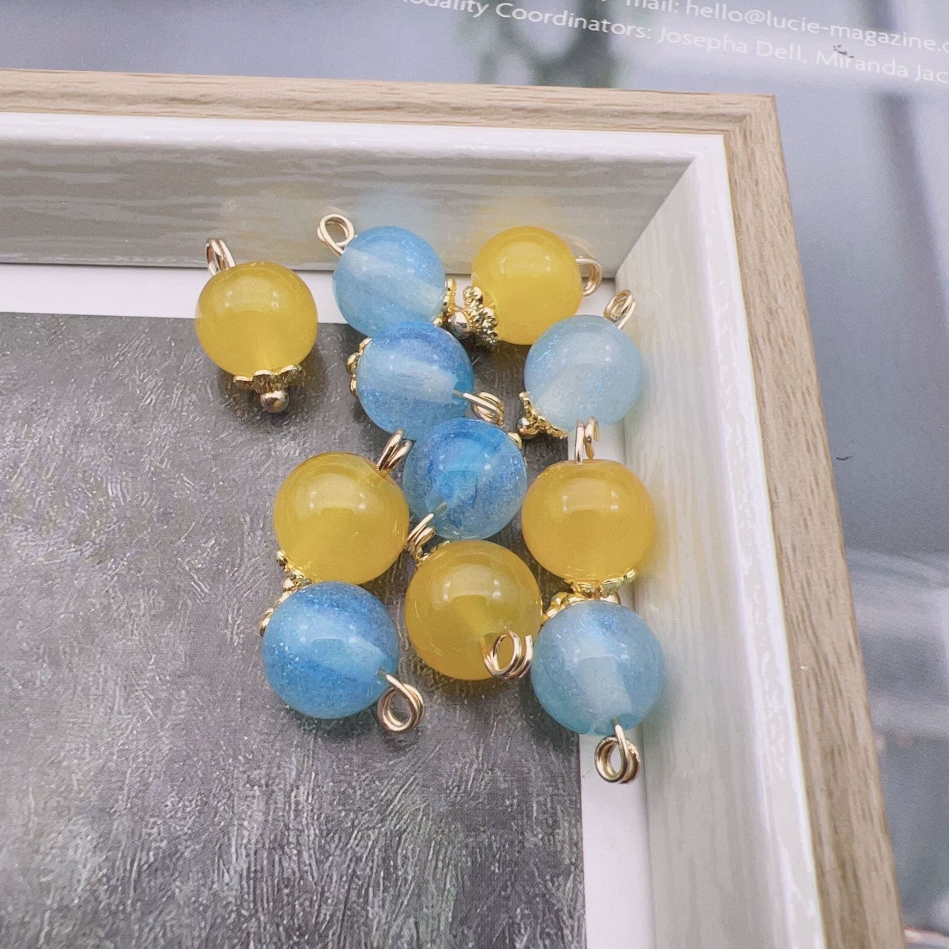9mm glass bead buttons set: blue and yellow round beads with gold-tone loops
