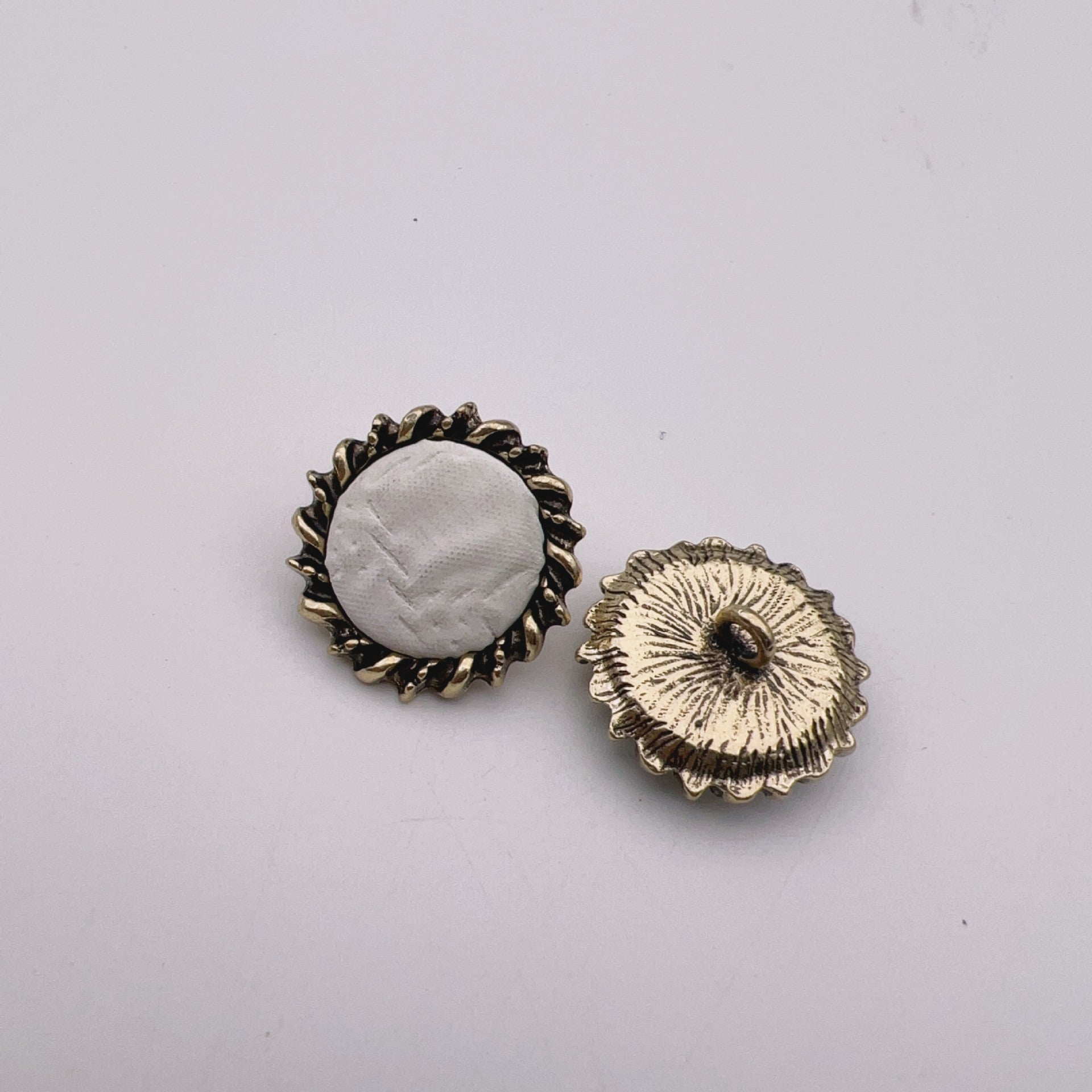 23mm leather buttons, white fabric center with antique bronze rim and textured cream insert