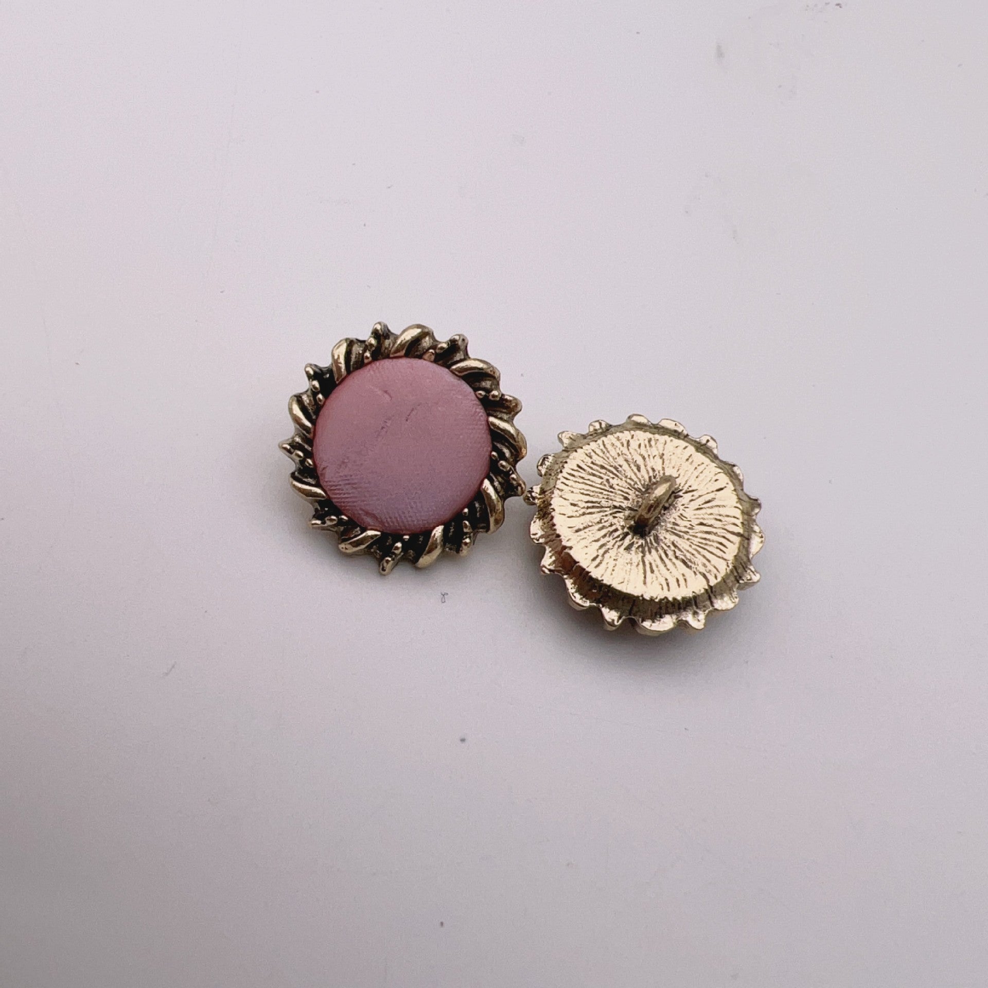 23mm leather buttons, rose pink fabric center with antique bronze rim and cream textured face
