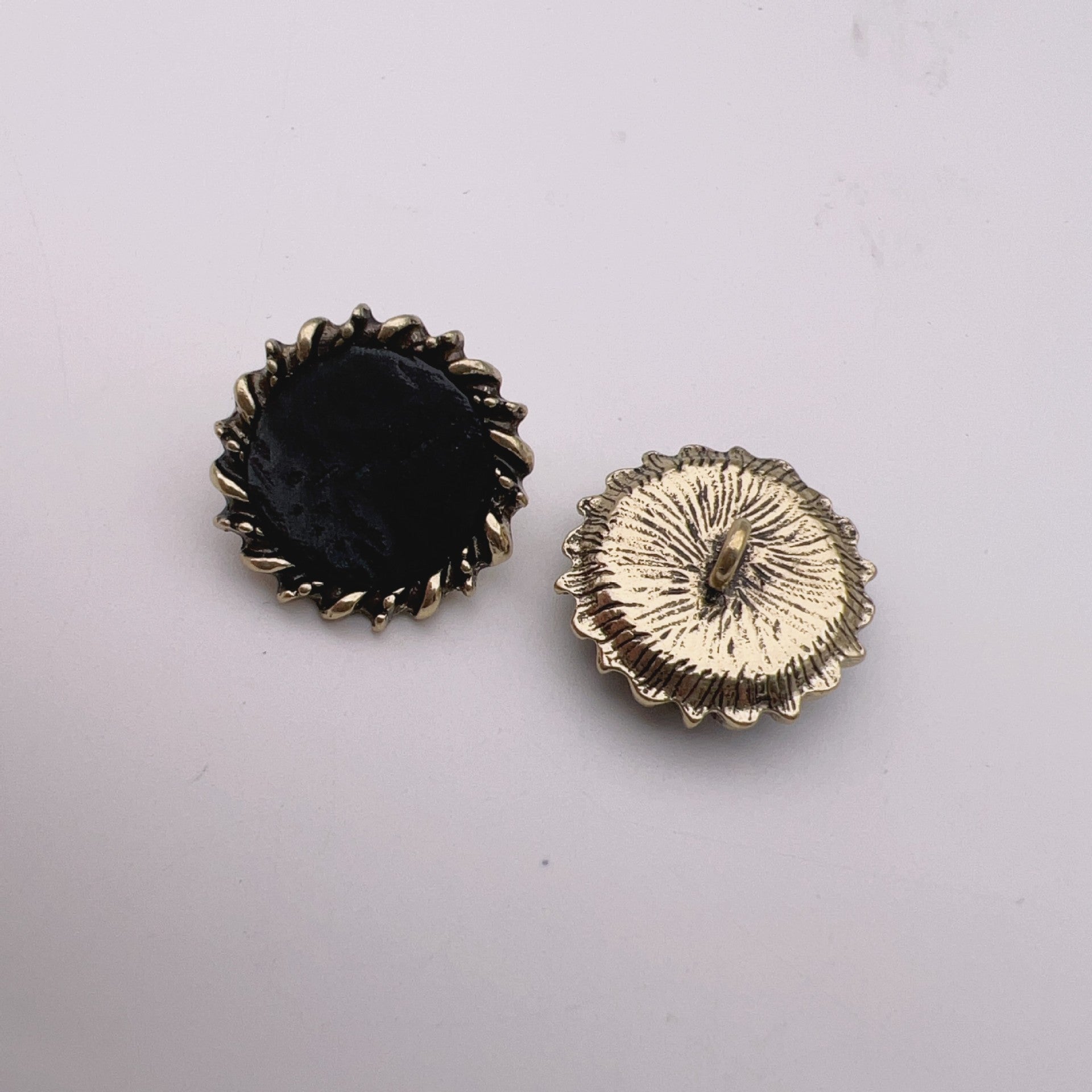 23mm leather buttons, black fabric center with antique bronze rim and cream sunburst face