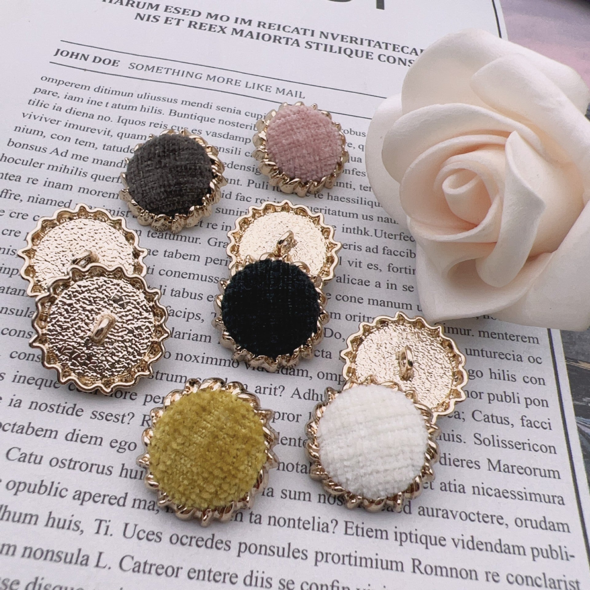 Set of round 25mm velvet fabric gear buttons, gold-tone metal; mixed colors.