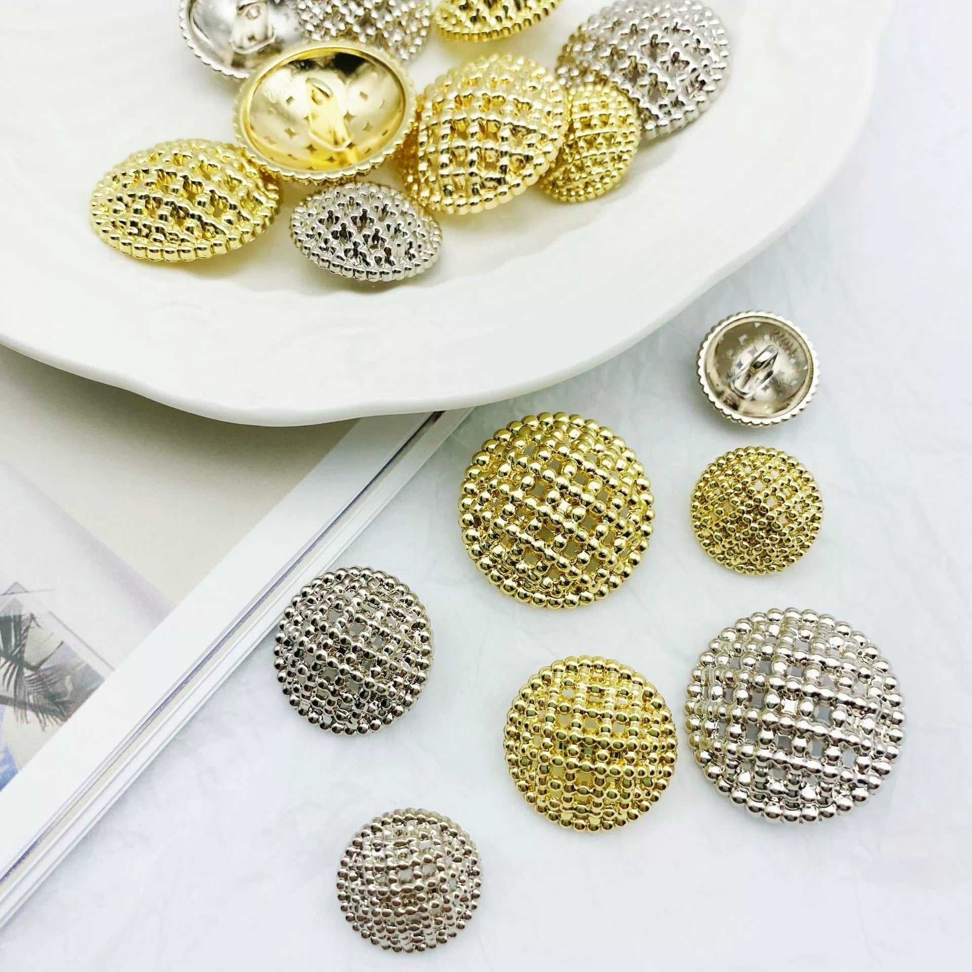Round hollow-shank metal buttons, textured gold and silver faces, mixed set