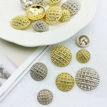 Round hollow-shank metal buttons, textured gold and silver faces, mixed set