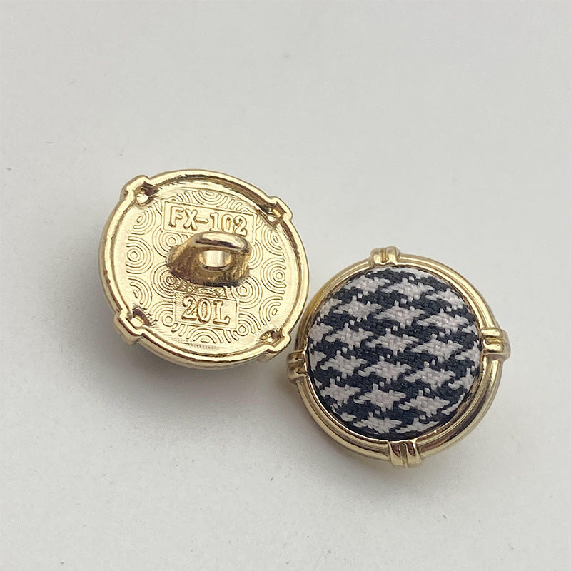 Houndstooth metal shank button pair, gold-tone frame, navy and cream patterned fabric