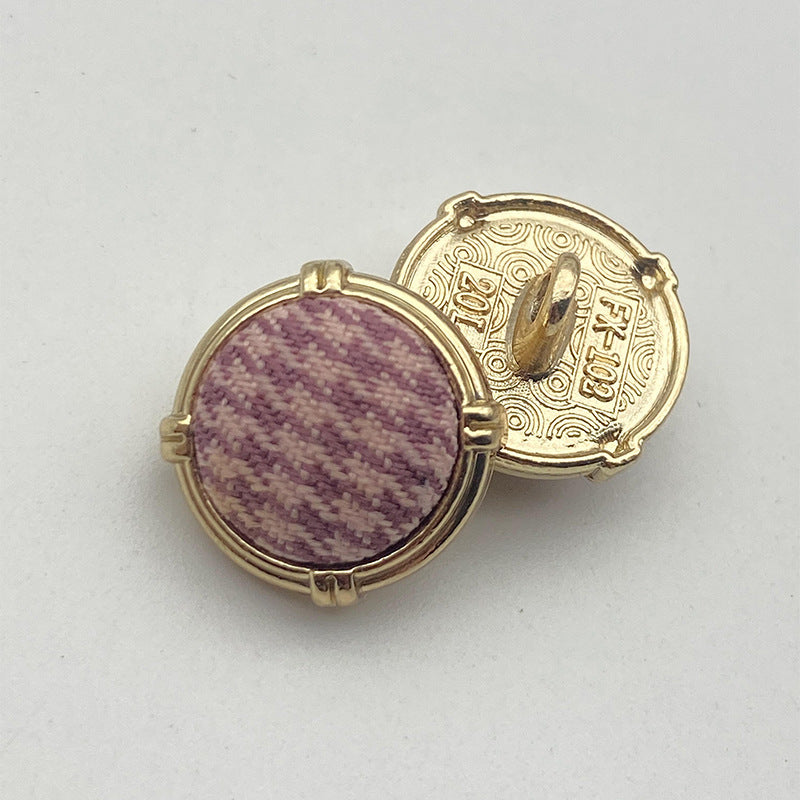 Houndstooth metal shank button pair, gold-tone frame, purple patterned fabric front
