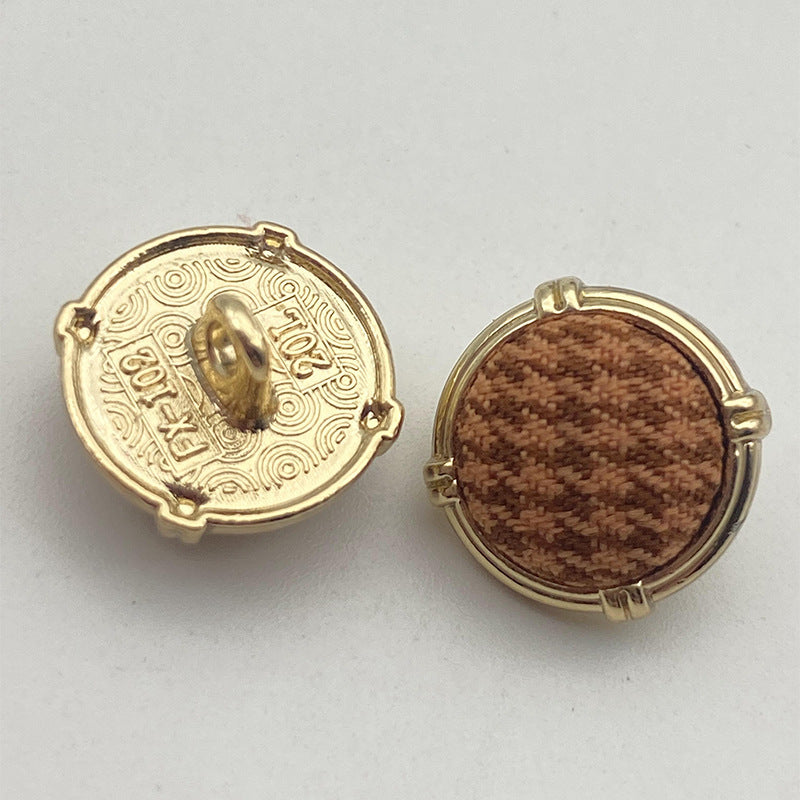Houndstooth metal shank button pair, gold-tone frame, brown patterned fabric front