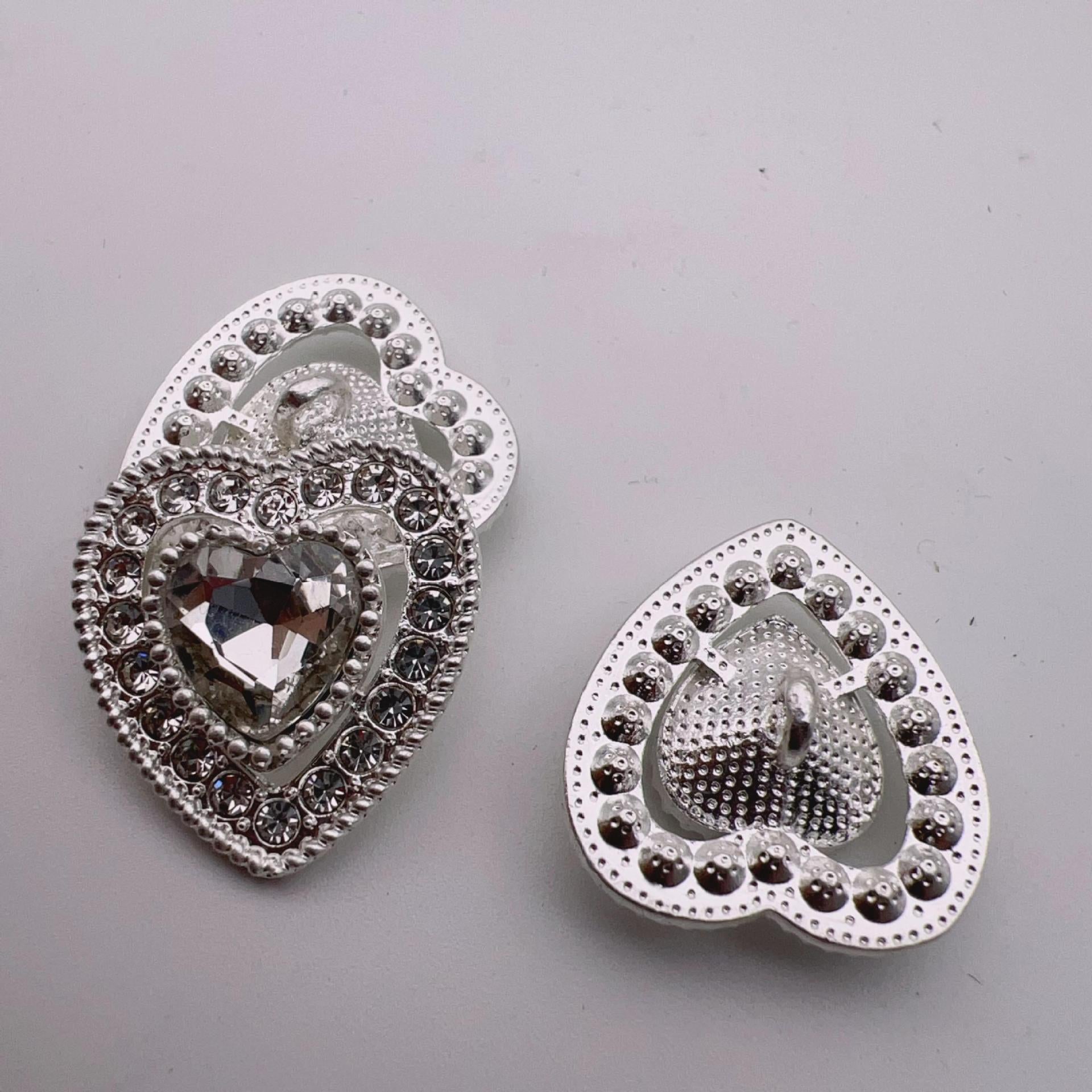 Heart-shaped crystal metal shank buttons, silver tone, front and back views