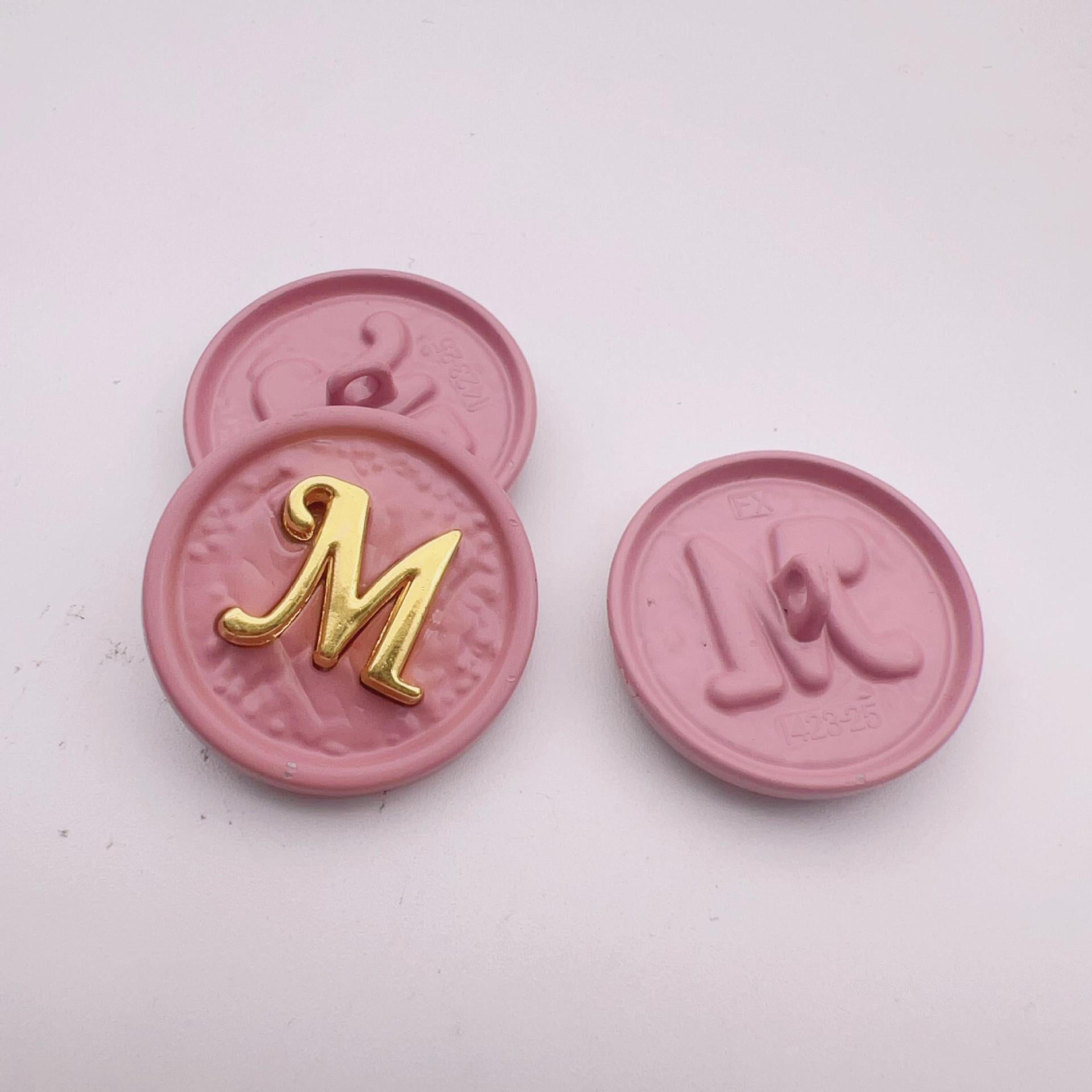 25mm round metal button, letter M, gold on pink, front and back, set of 48