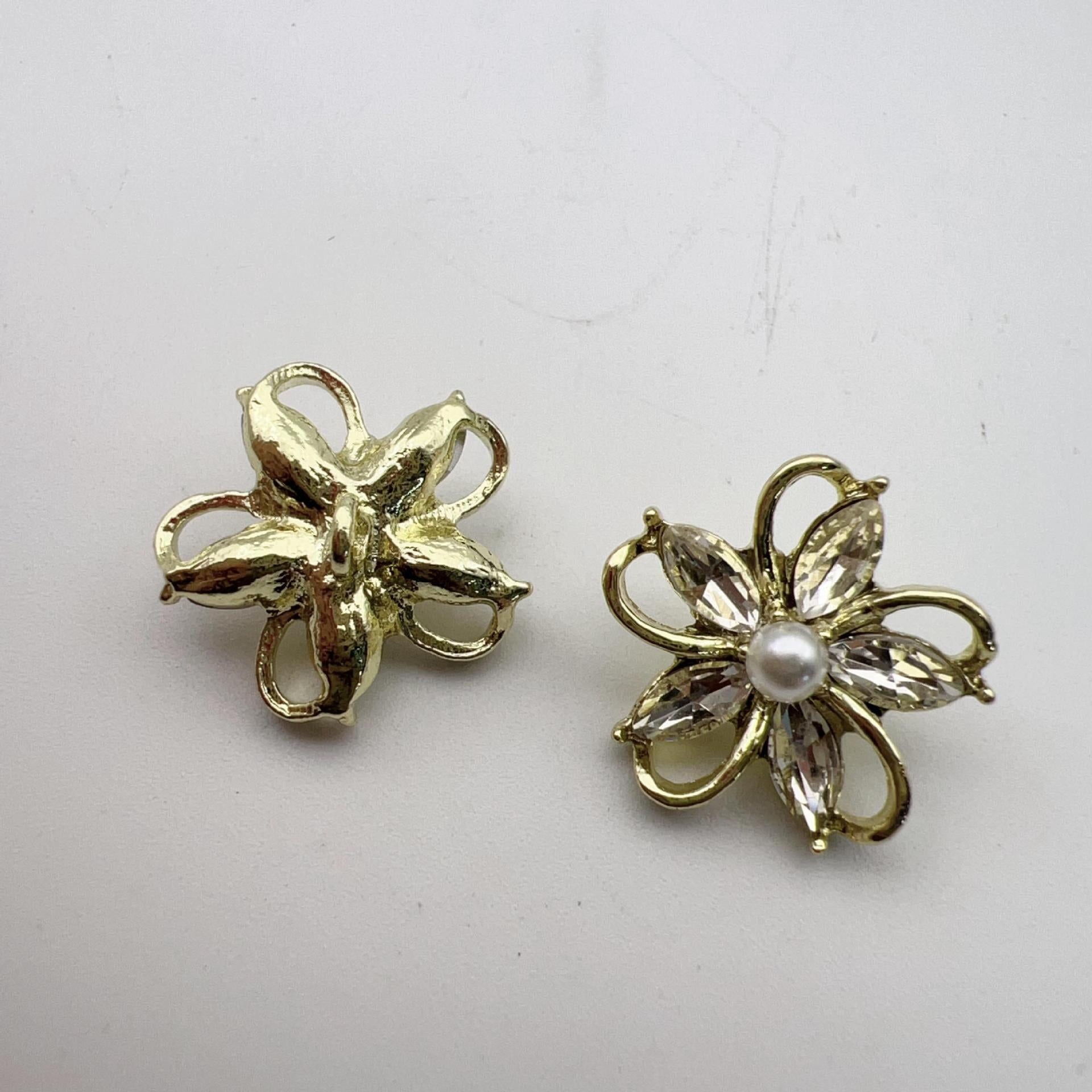 Vintage gold flower buttons with crystal petals and white pearl center; left plain gold flower