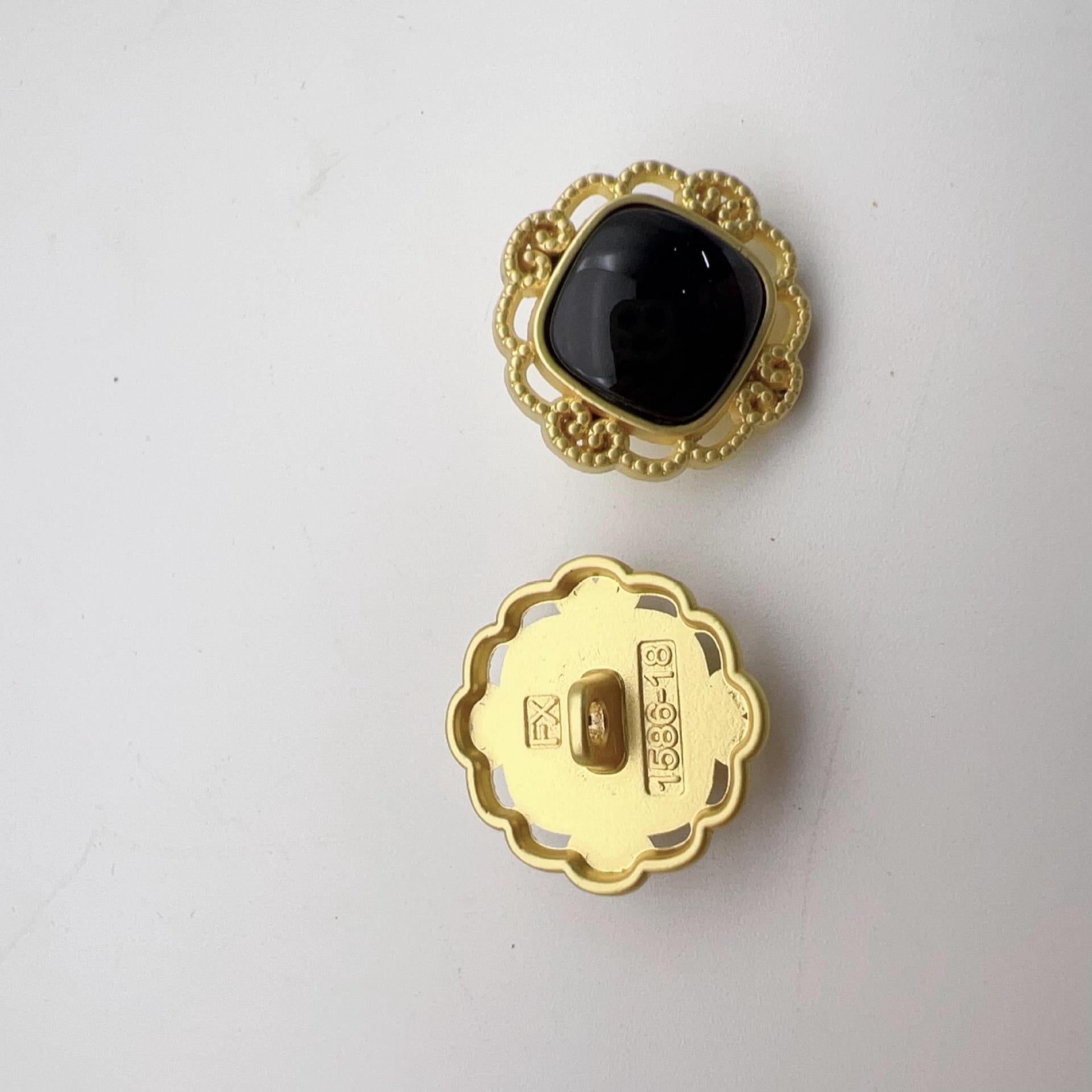 Hollow pearl shank button, gold scalloped frame with black faux pearl front