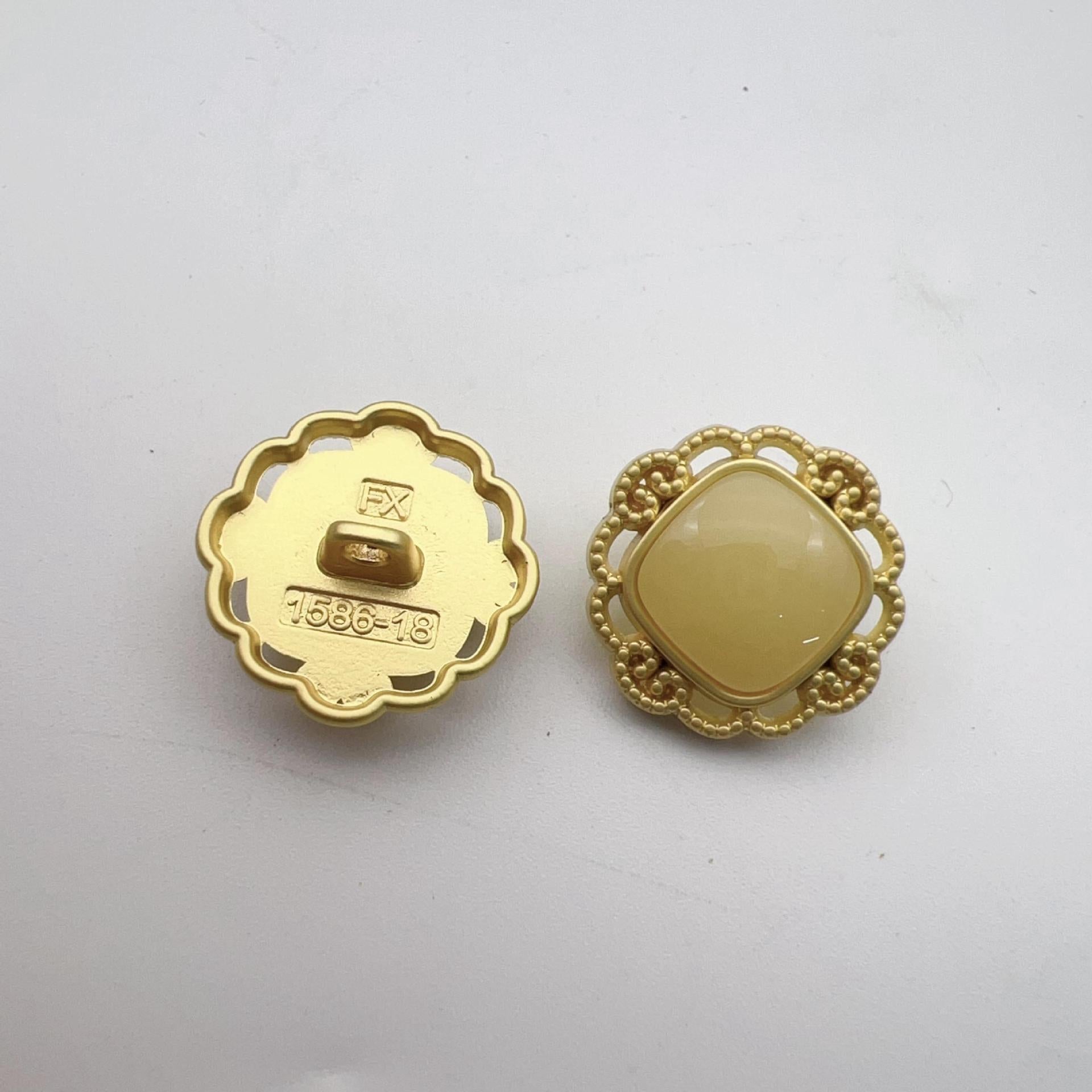 Hollow pearl shank buttons: gold back with markings, cream faux pearl front