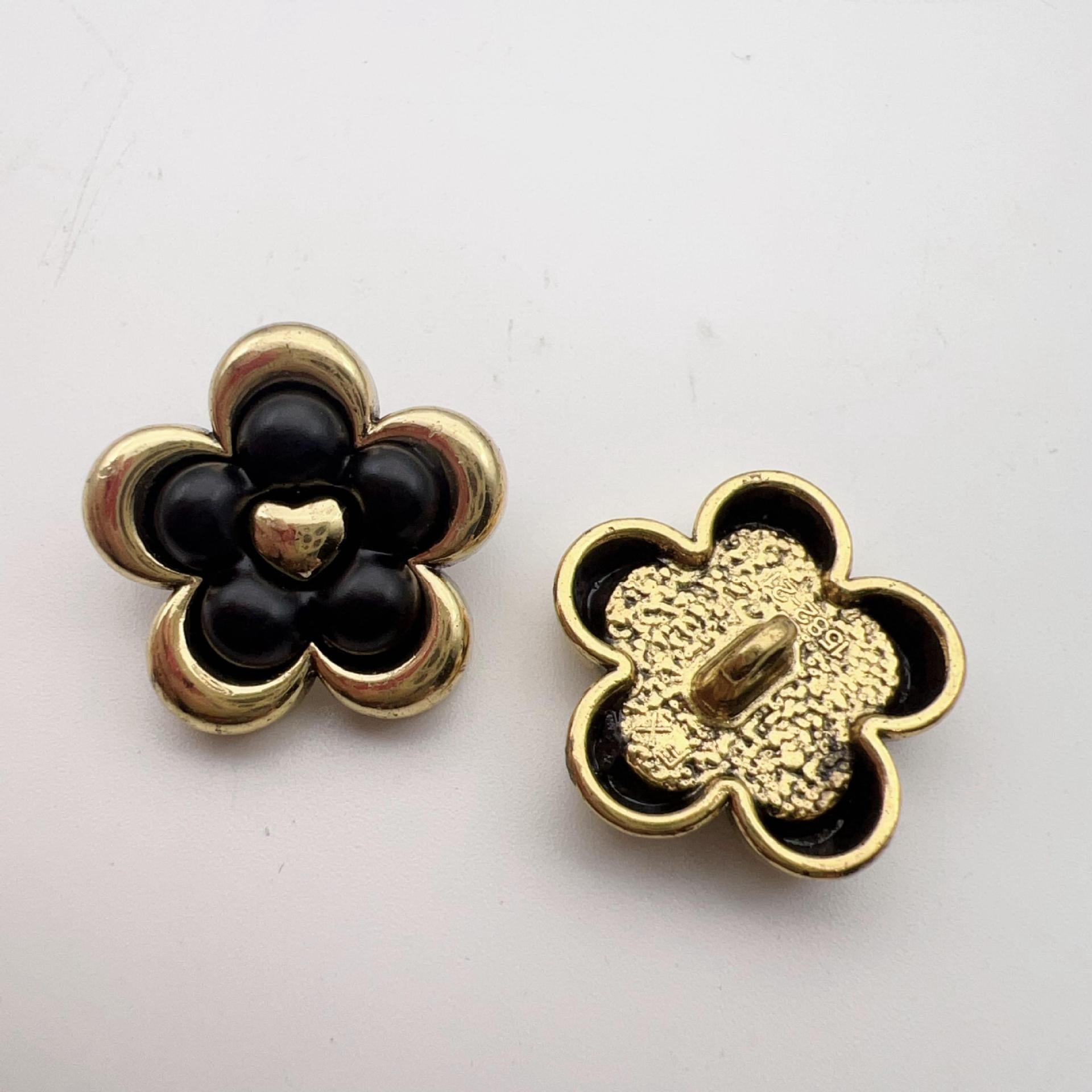 Vintage five-petal flower metal dot shank buttons, dark front, gold-and-black back