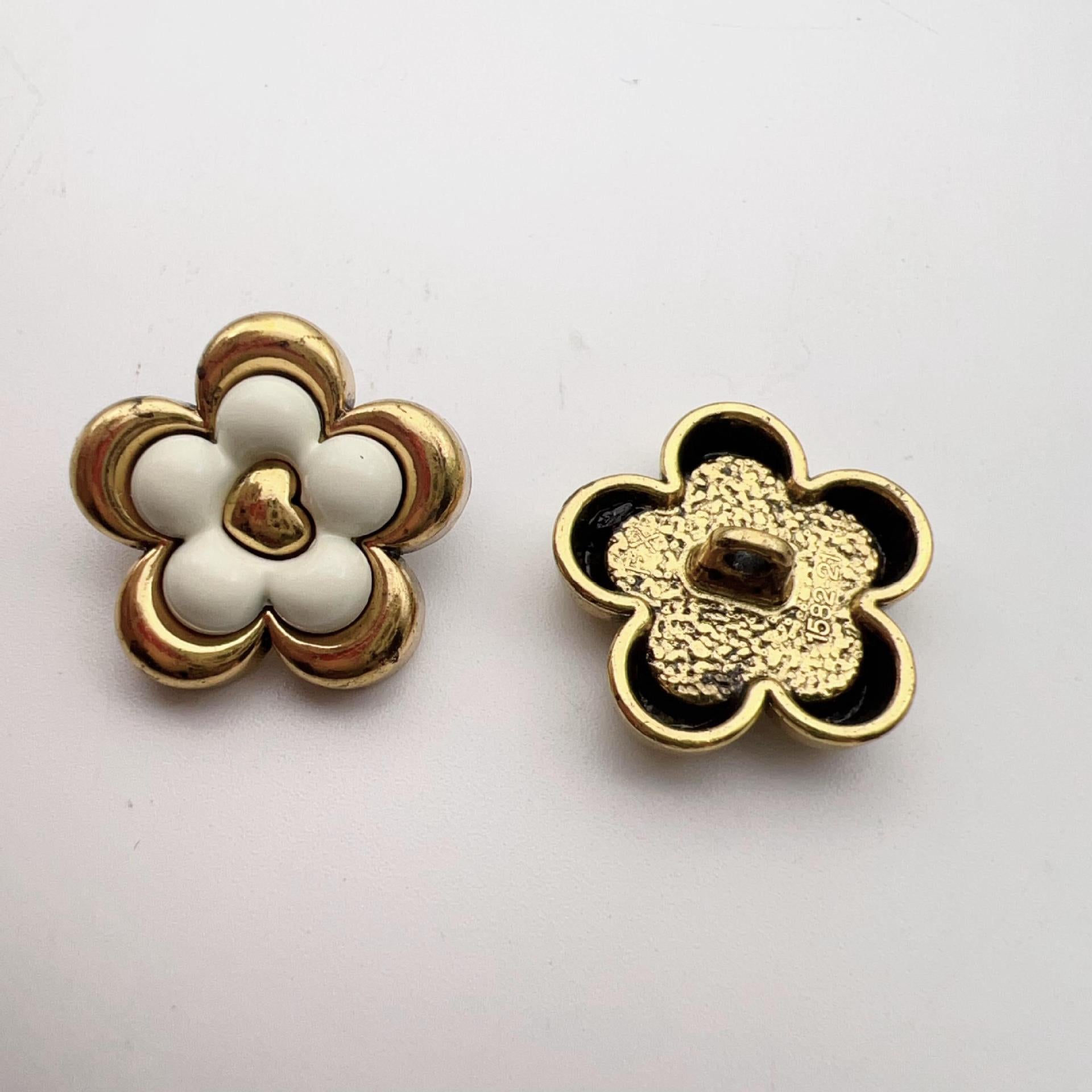 Vintage five-petal flower metal dot shank buttons, white front, gold-and-black back