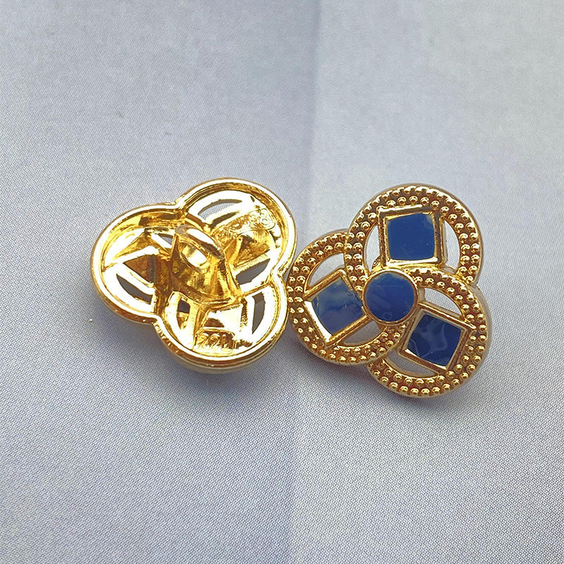 Clover-shaped flower metal shank shirt button, blue inset squares, gold-tone finish