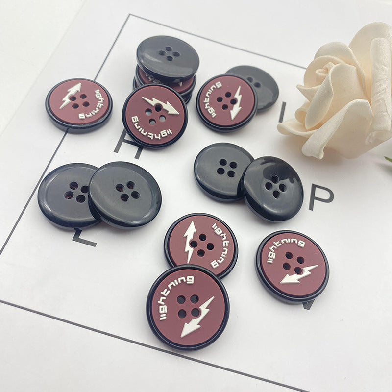 Round 4-hole lightning motif buttons in dark blue and gray, resin look