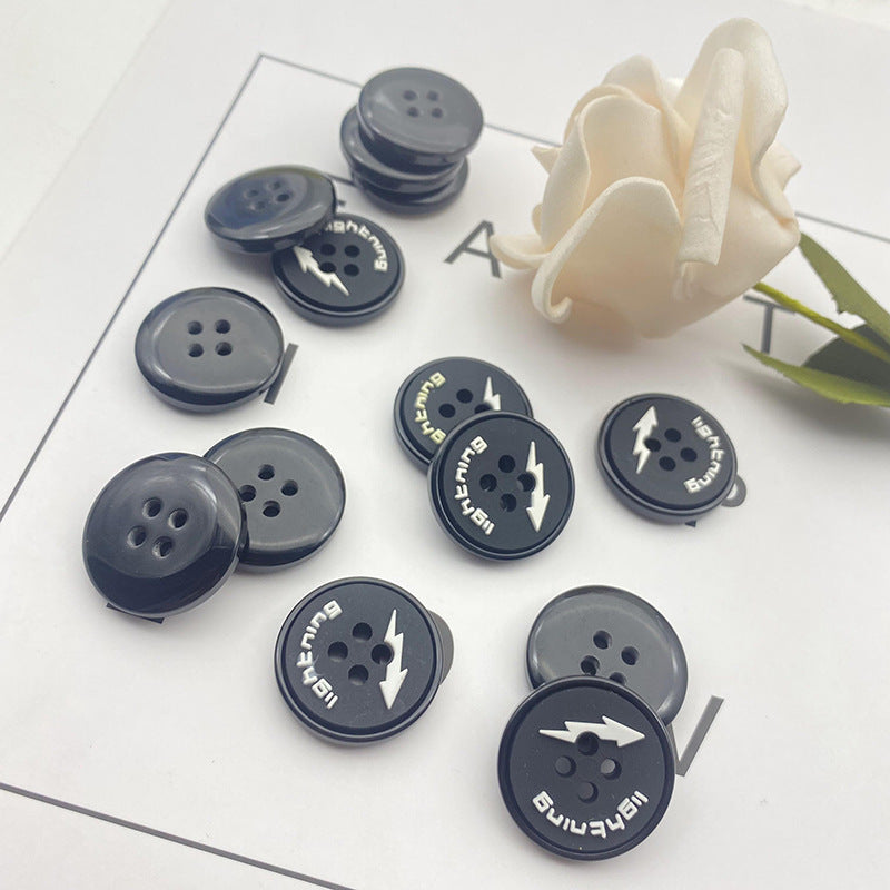 Round 4-hole buttons in dark gray/blue with lightning symbol, multiple pieces