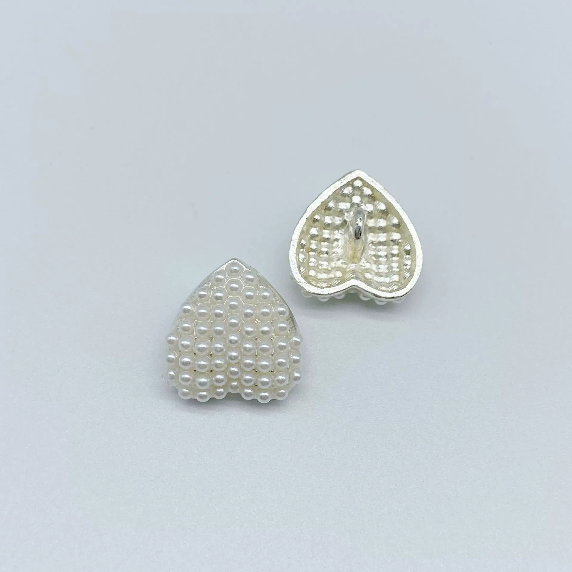 Two heart coat buttons: white pearl and silver rhinestone, metal shank