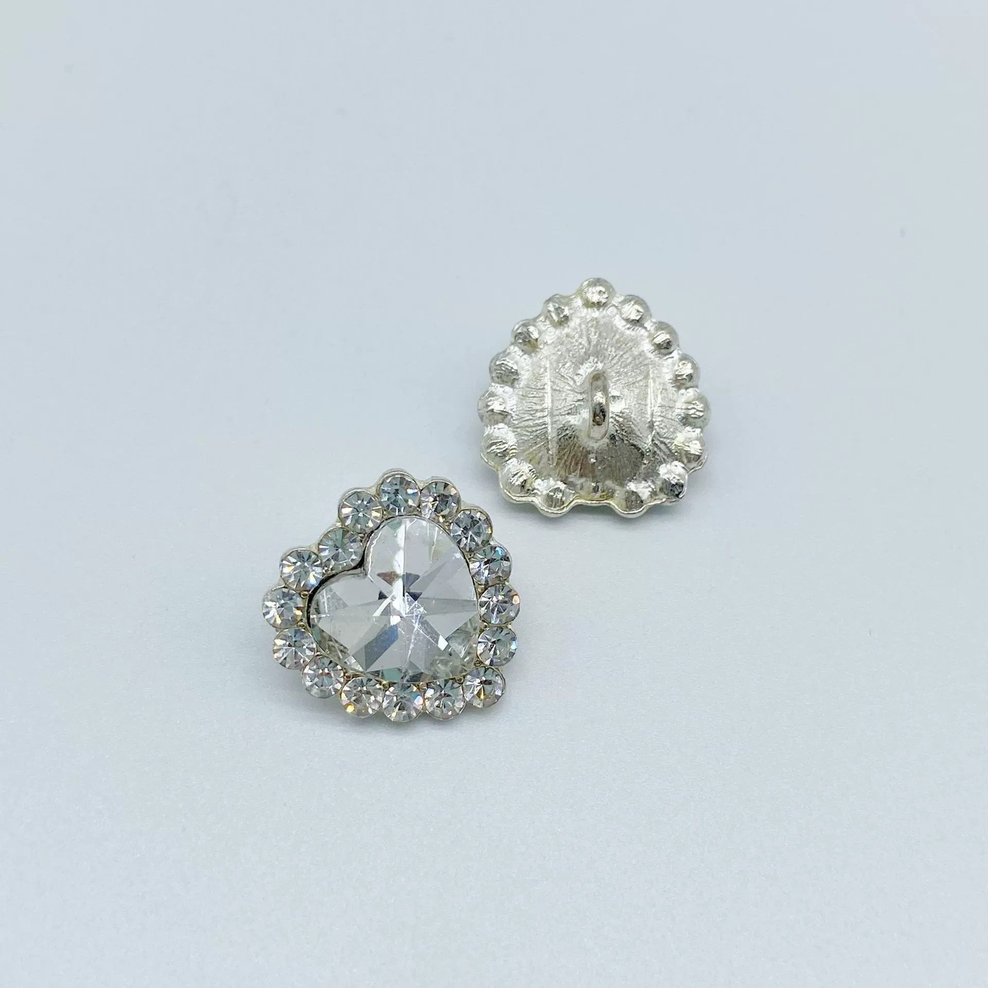 Silver heart coat button with clear rhinestone center and metal shank