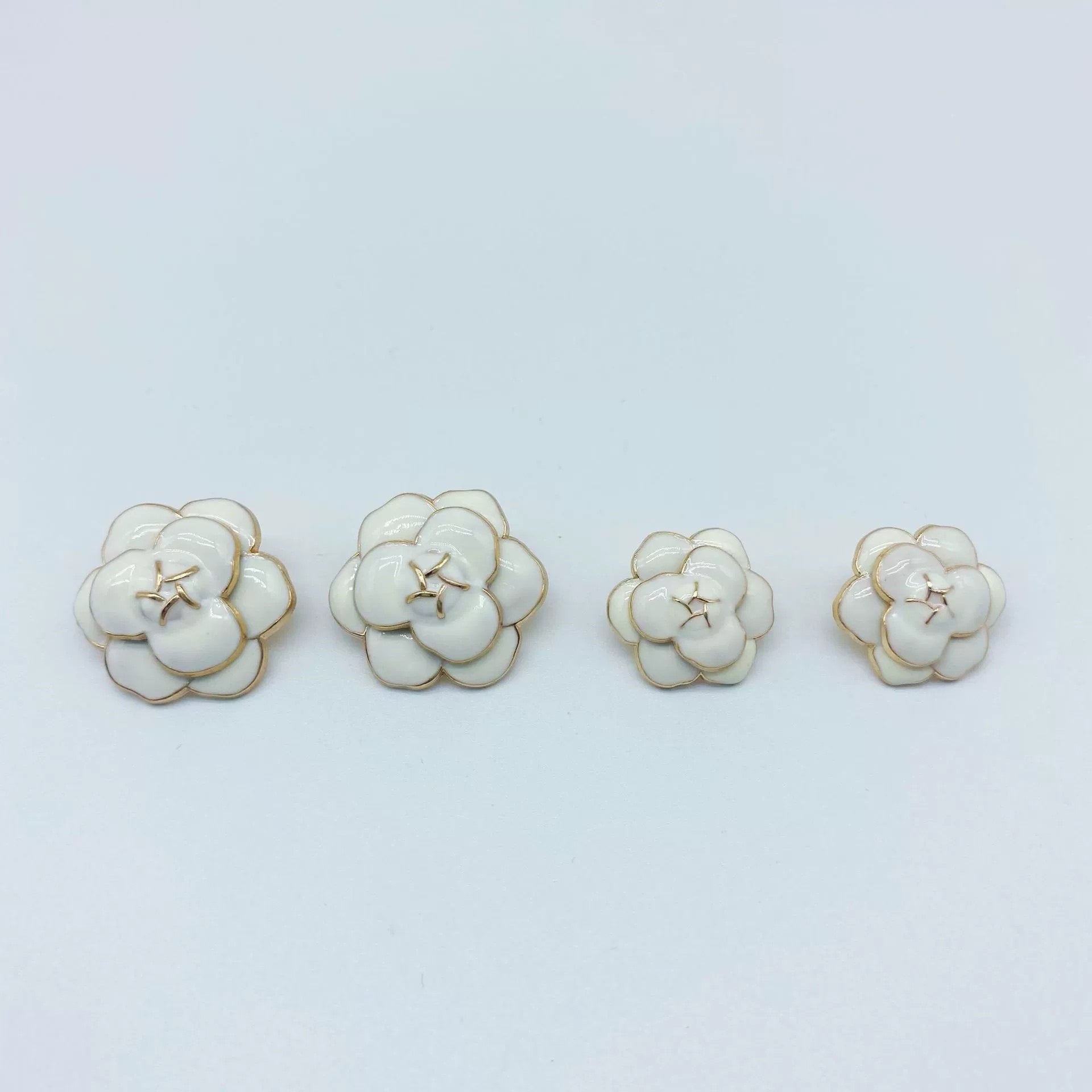 White camellia metal buttons gold-tone shank, glossy enamel, four shown