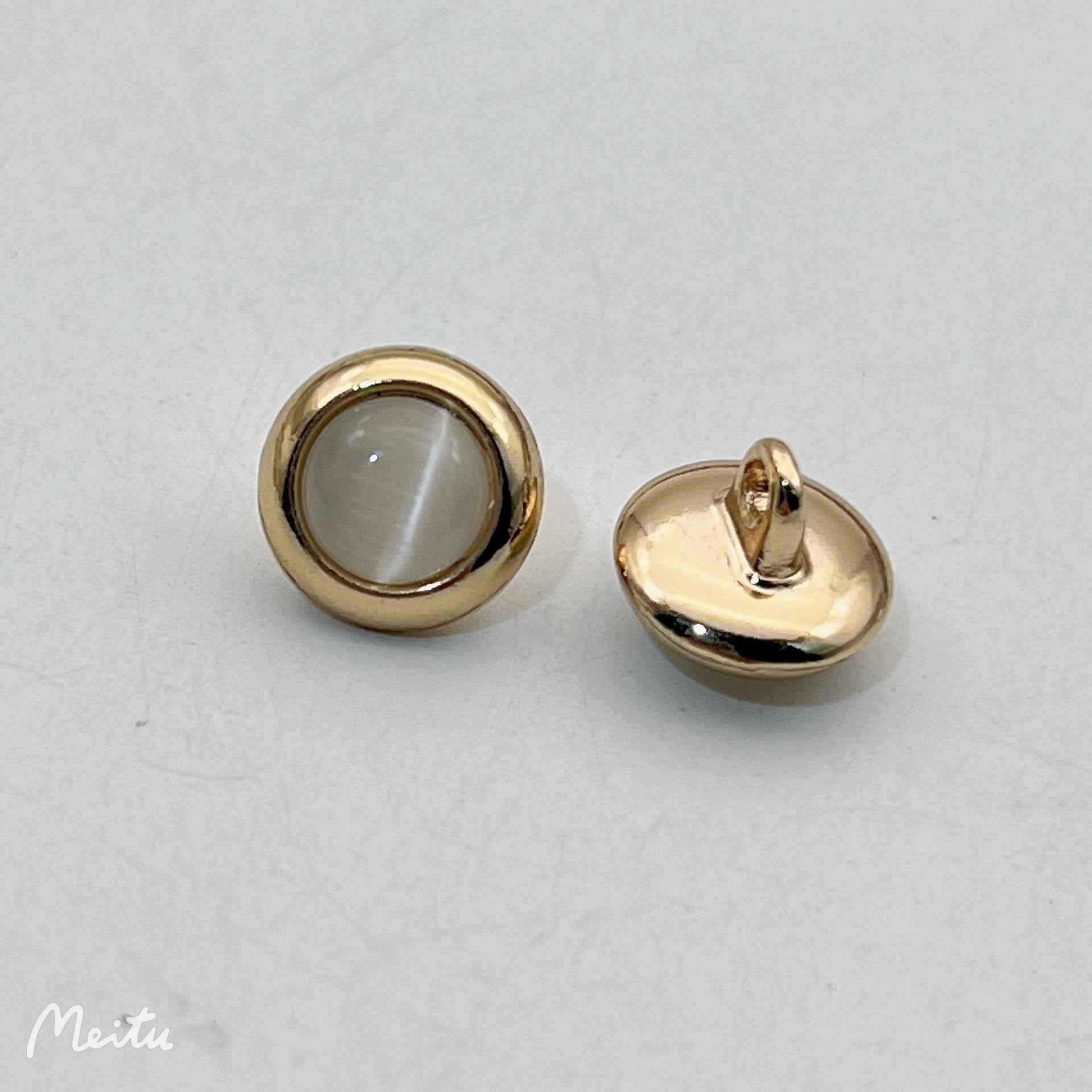 12.5mm cat’s eye metal shirt button in white/clear, gold-tone rim