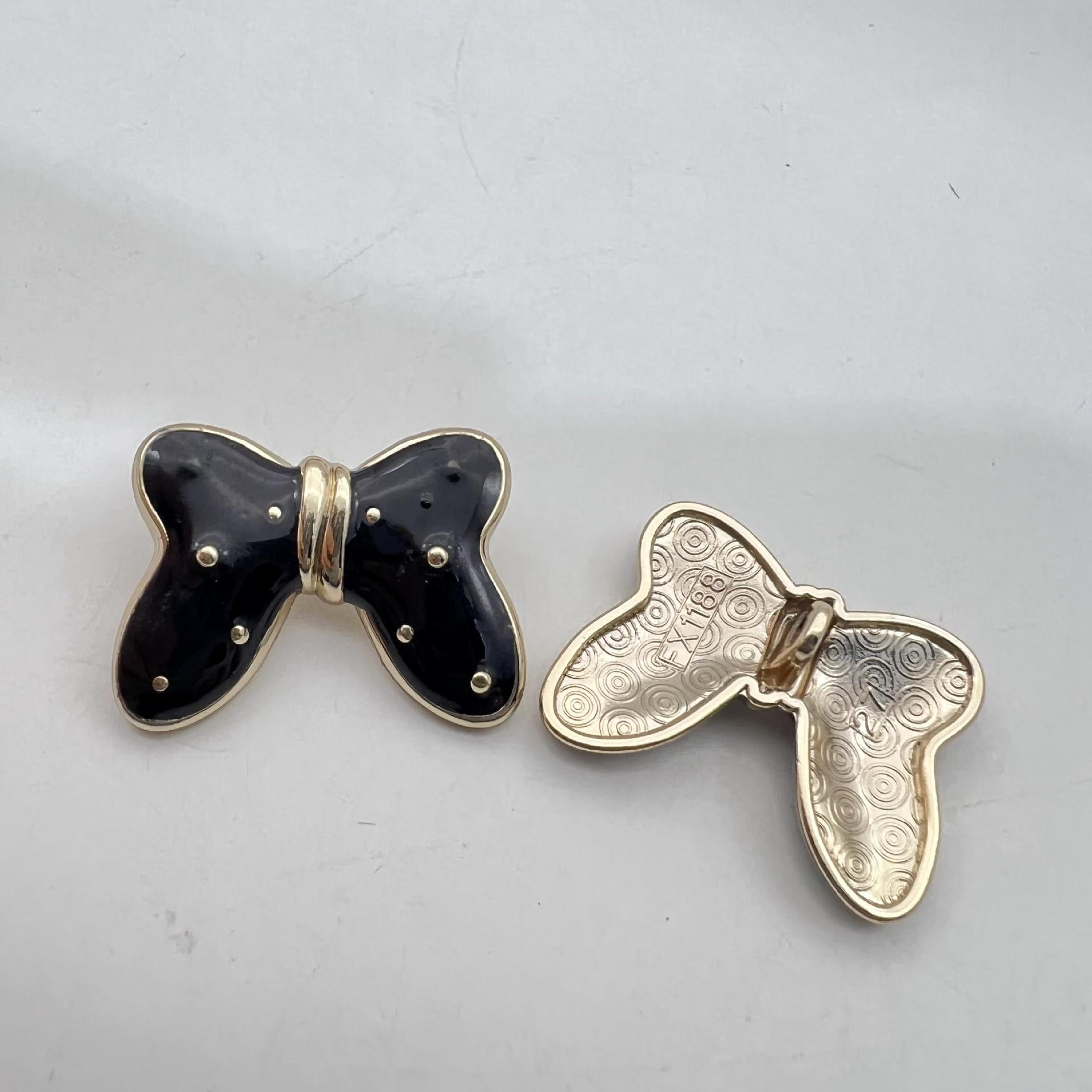 Black butterfly starry metal large shank button with gold-tone border and studs