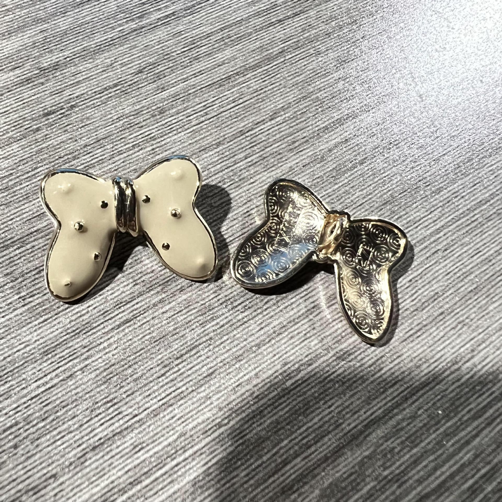 Light cream butterfly starry metal large shank button with silver-tone filigree