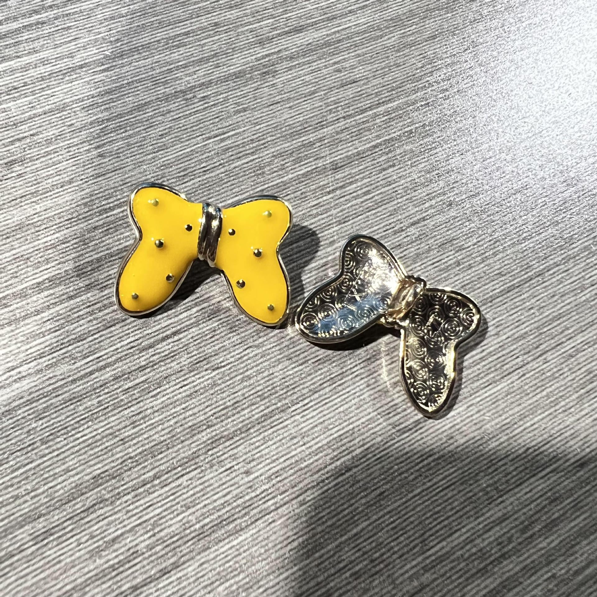 Yellow butterfly starry metal large shank button with silver-tone filigree