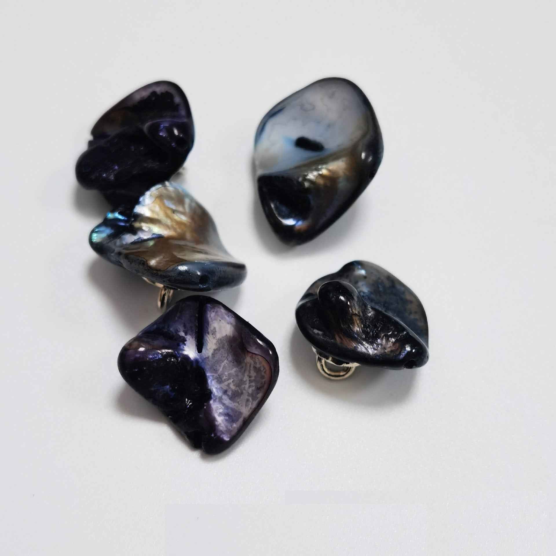 Dark blue/purple irregular shell shank buttons with metal loop shanks, glossy.