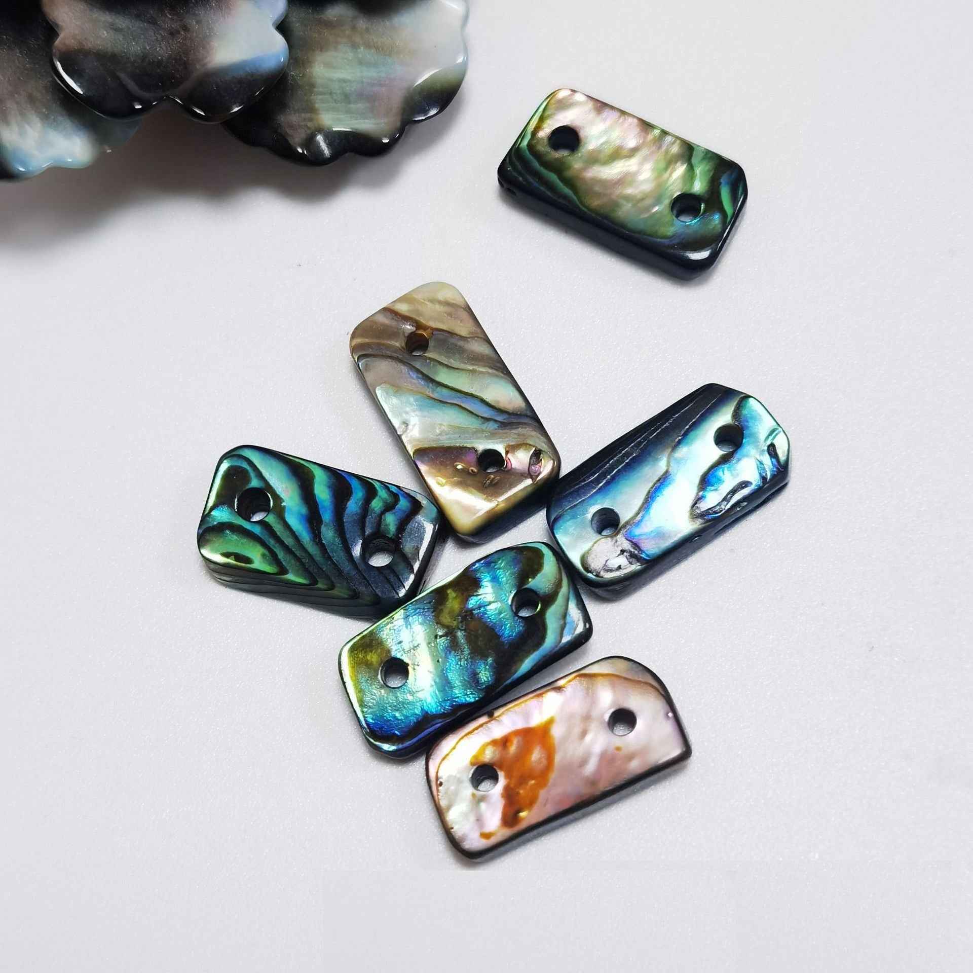 Set of blue abalone shell logo decorative buttons, assorted rectangles with 2 holes each